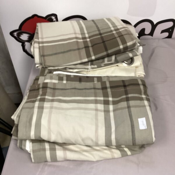 Pair of neutral striped curtains presented for auction.