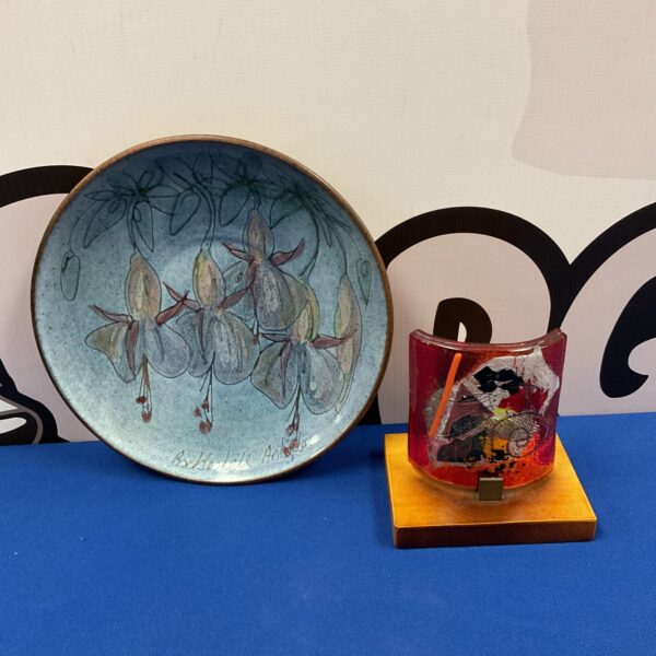 Signed studio pottery plate with art glass piece, vintage collectible.
