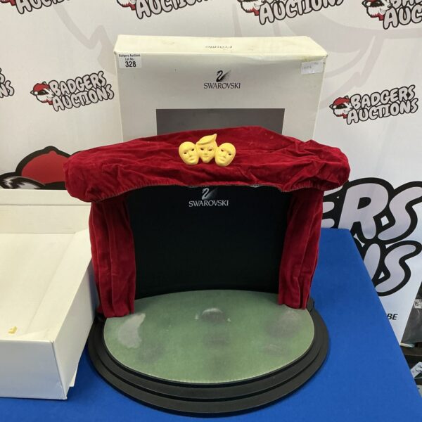 Clear acrylic Swarovski display stand for figurines.