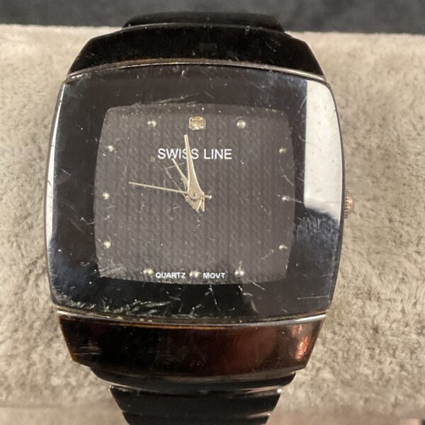 Front view of a vintage Swiss Line quartz wristwatch.