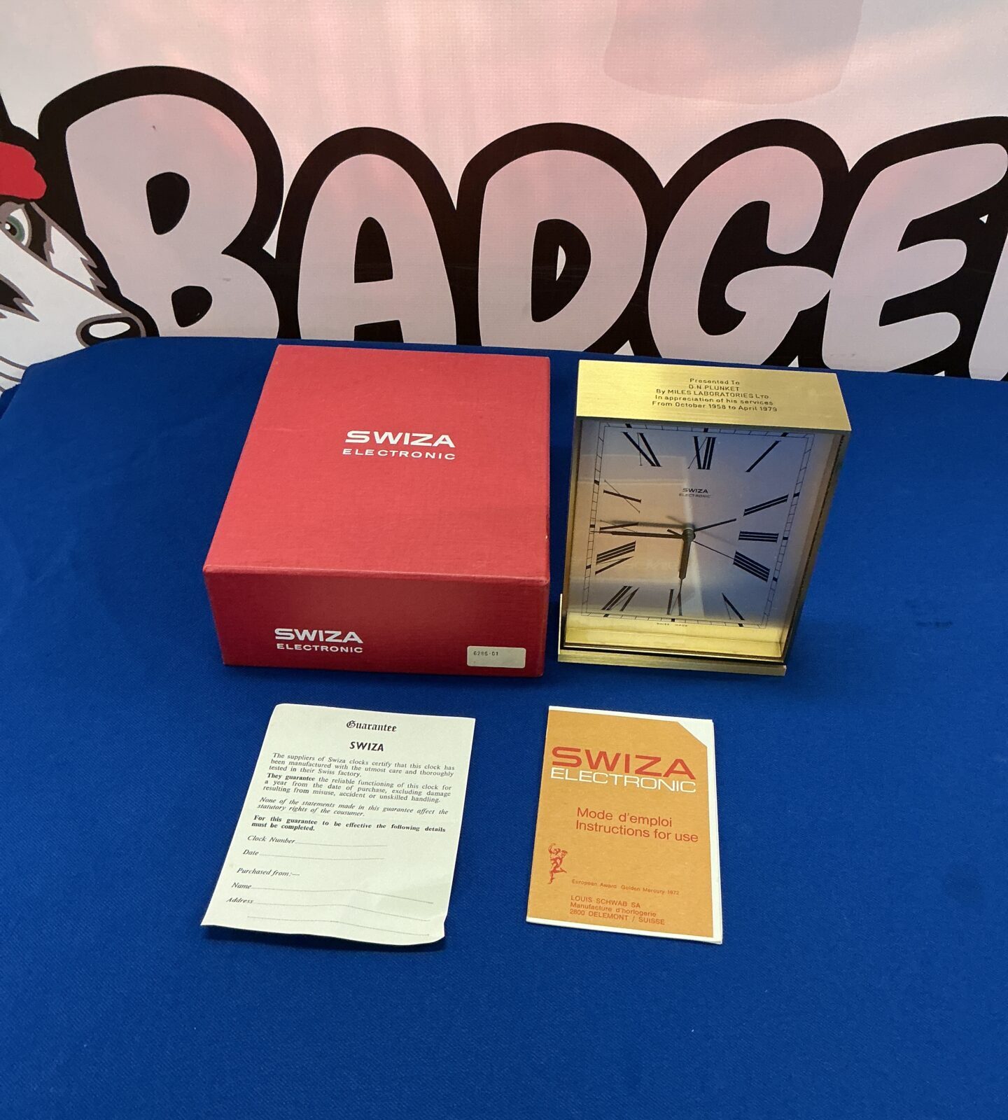 Vintage Swiza electronic mantle clock with original box, a classic timepiece.