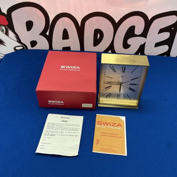 Vintage Swiza electronic mantle clock with original box, a classic timepiece.