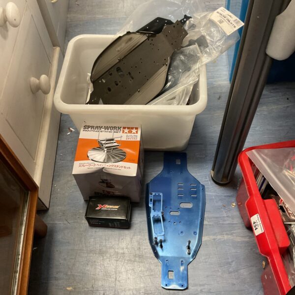 Tamiya RC car parts and accessories lot for hobbyists.