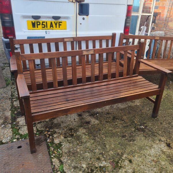 Solid teak garden bench with slatted seat and back.