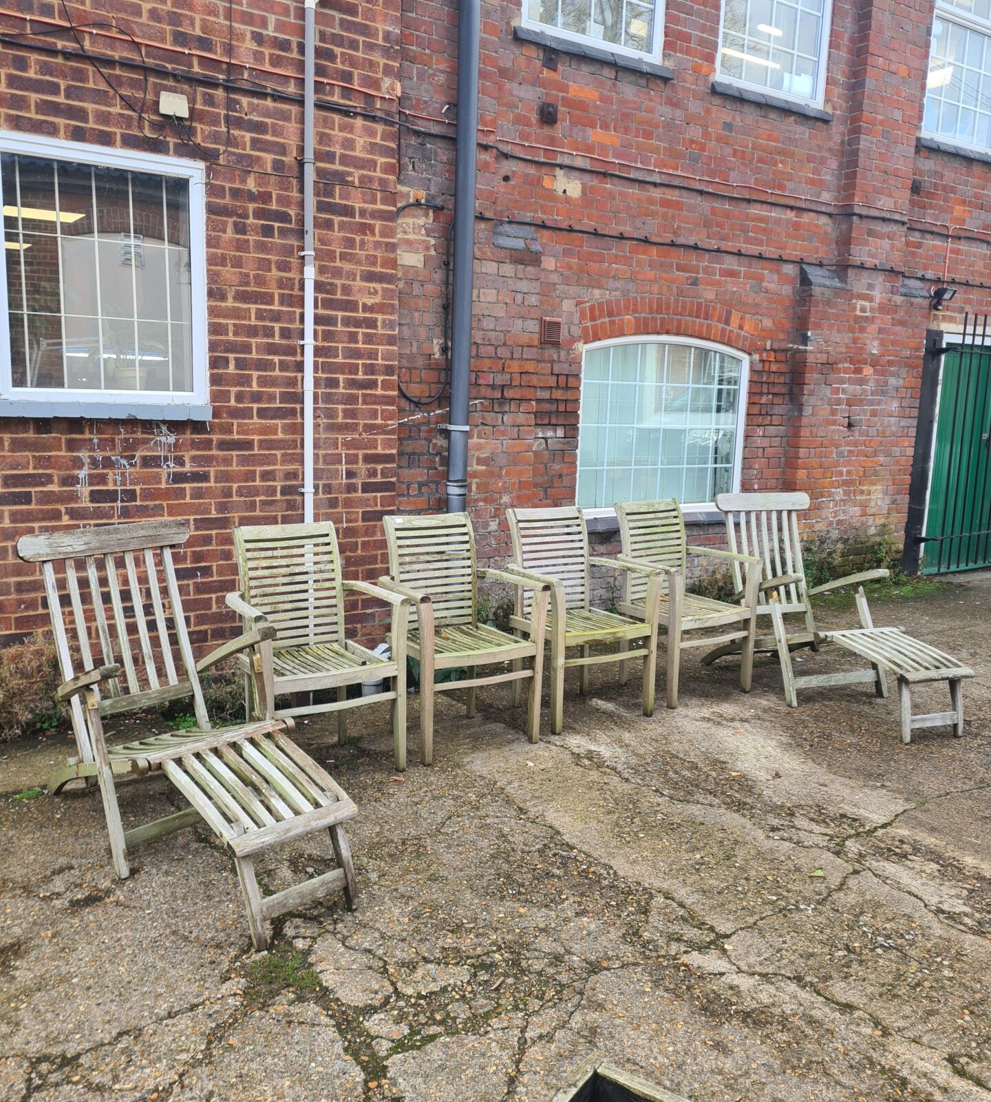 Vintage teak garden furniture set on a patio.