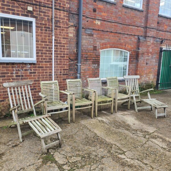 Vintage teak garden furniture set on a patio.