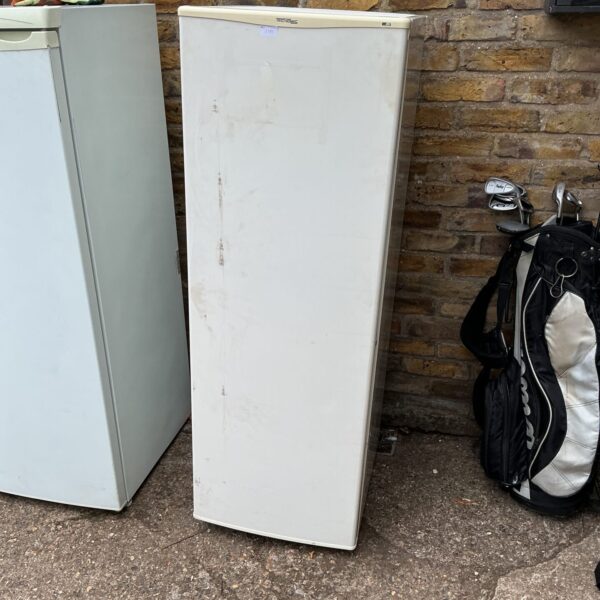 White Tecnolec tall freezer in used condition.