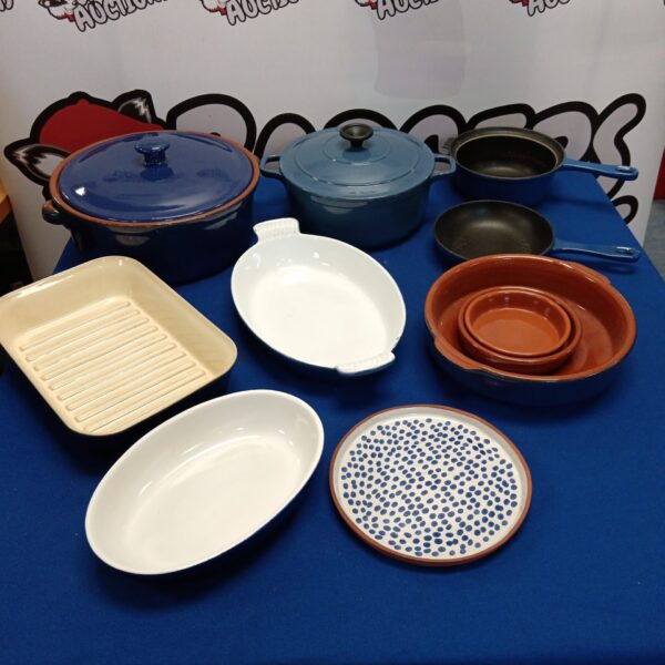Vintage terracotta and cast iron cookware lot for rustic cooking.