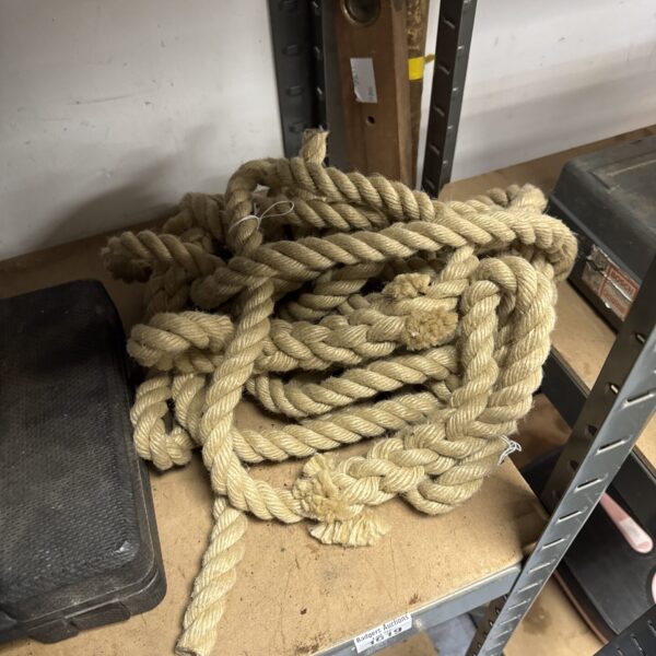 Coiled thick rope for industrial or nautical use.