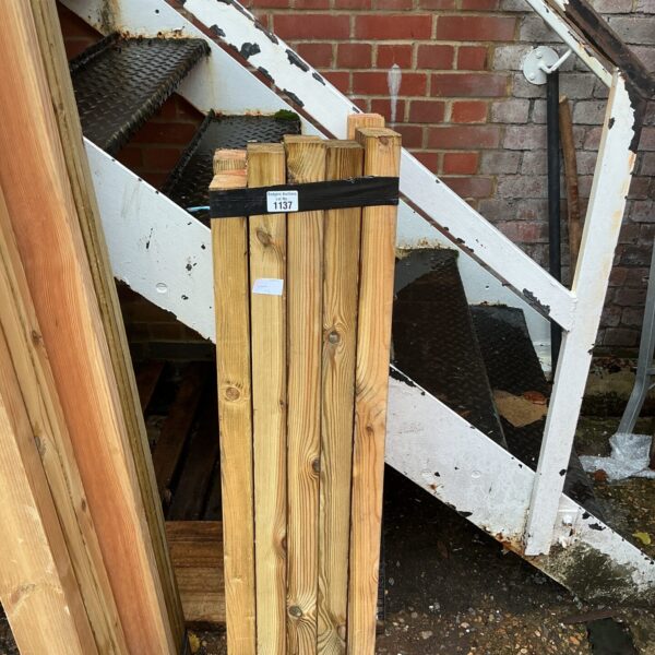 Three bundles of 3’6” timber stacked outdoors, ready for construction.