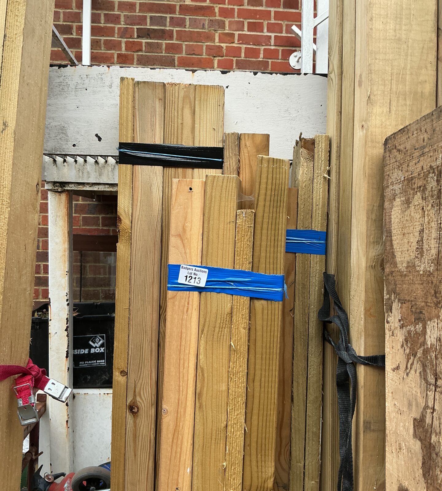 Stack of pine timber bundles for construction and DIY projects.