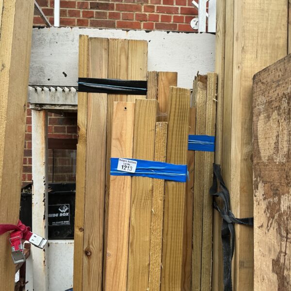 Stack of pine timber bundles for construction and DIY projects.