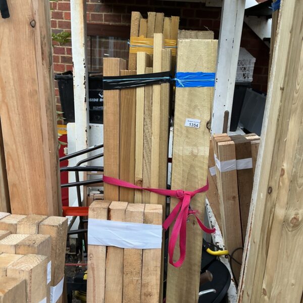 Three bundles of softwood timber secured with plastic strapping.