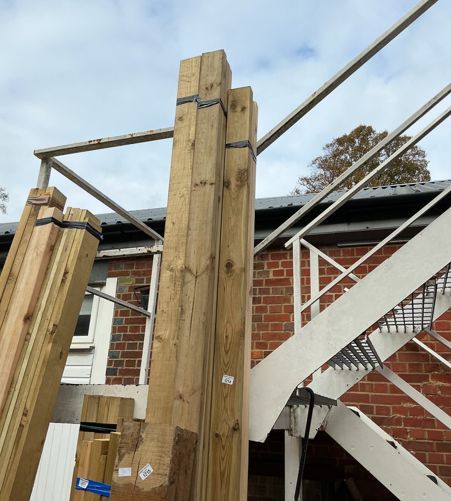 Stacked timber bundles ready for construction or DIY projects.