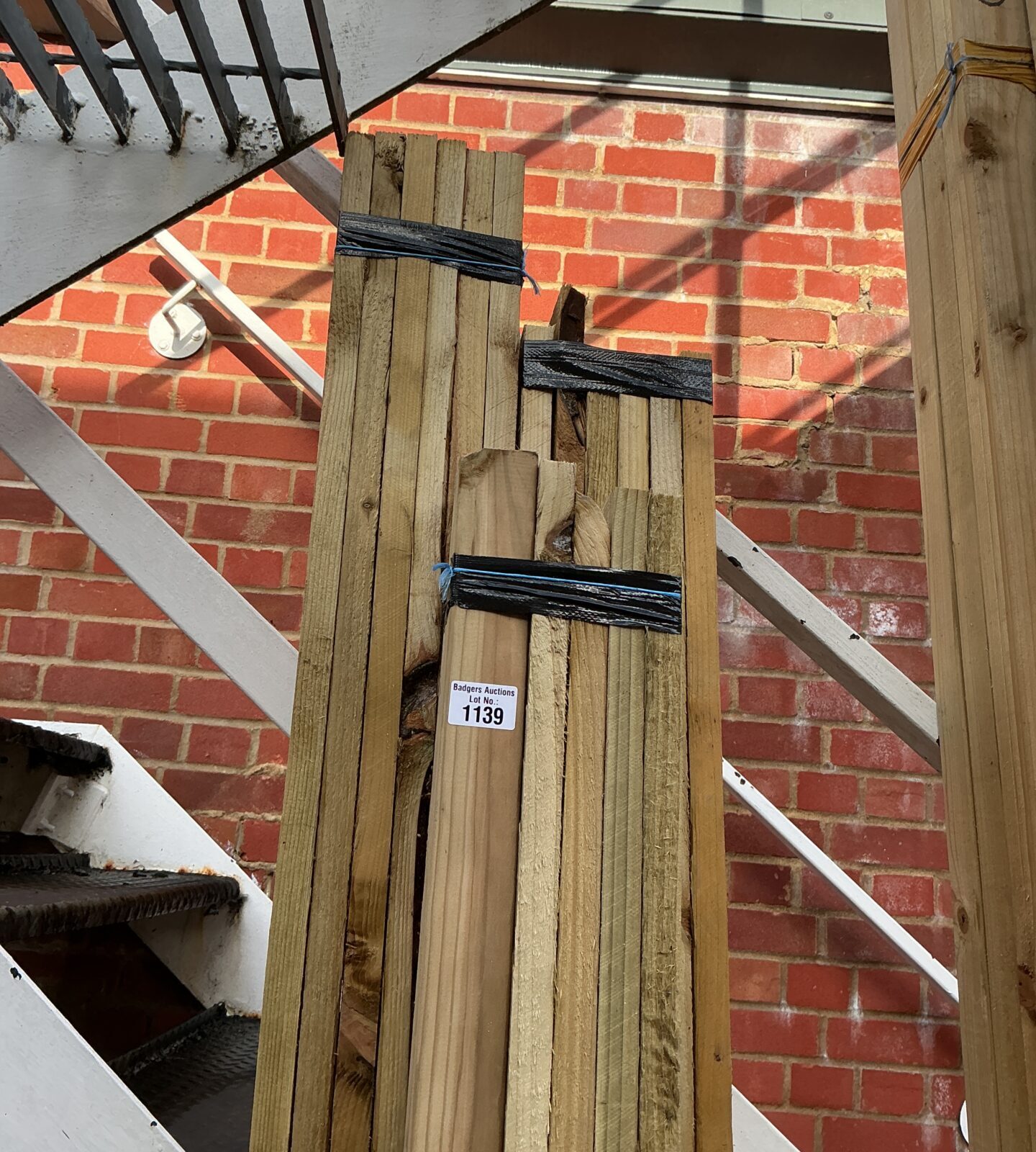 Stacked timber bundles for construction and DIY projects.