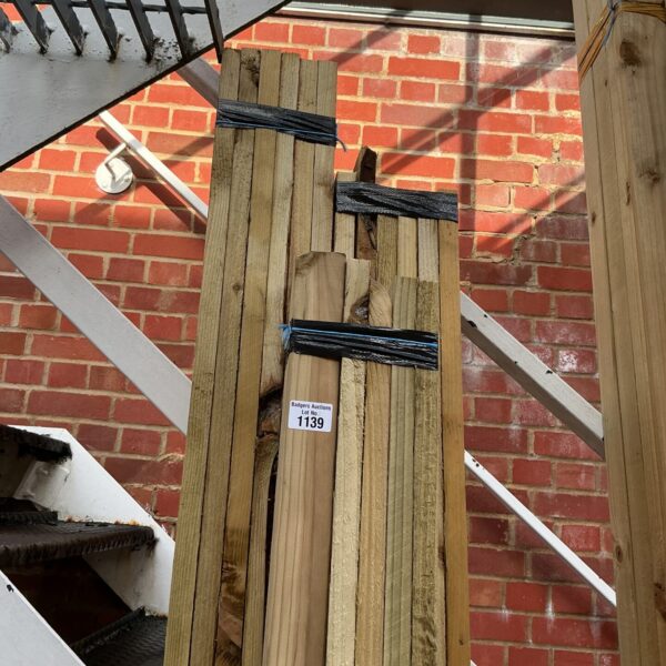 Stacked timber bundles for construction and DIY projects.