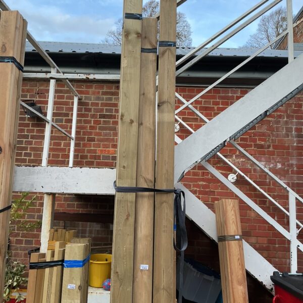 Stacked timber bundles for construction and DIY projects.