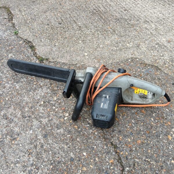 Used Titan electric chainsaw TTL758CHN for garden and DIY projects.