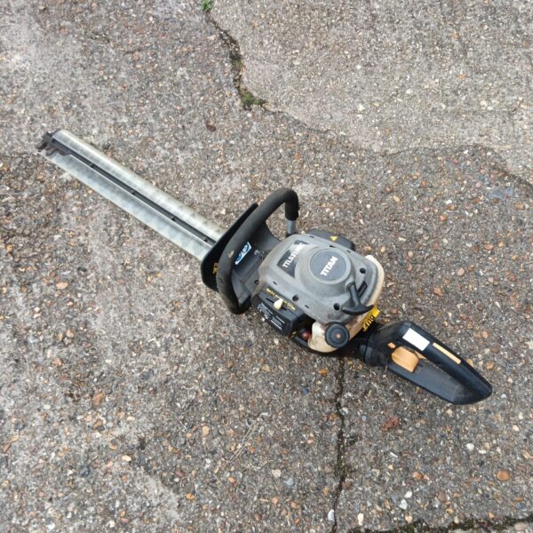 Titan TLL531HDC petrol hedge cutter for garden landscaping.