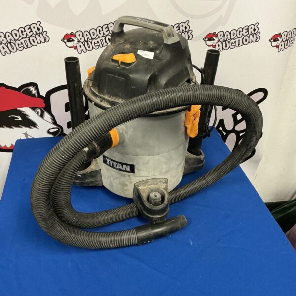 Titan wet/dry vacuum cleaner with flexible hose.