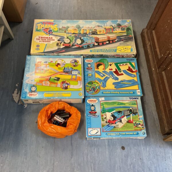 Vintage Tomy Thomas the Tank Engine playsets with track and trains.
