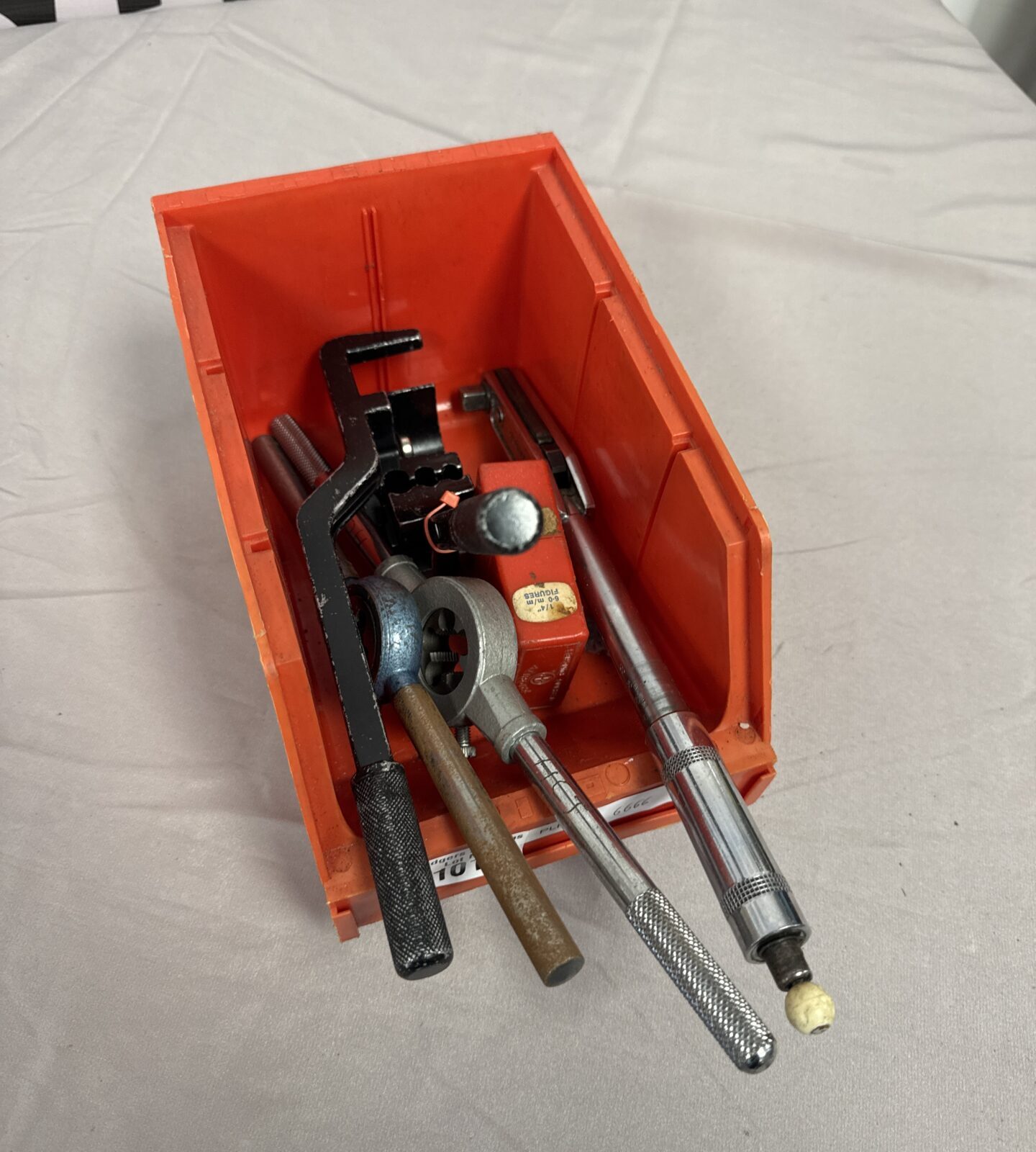 Tool lot featuring a small torque wrench and various hand tools.