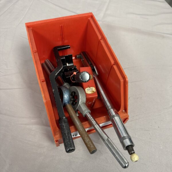 Tool lot featuring a small torque wrench and various hand tools.