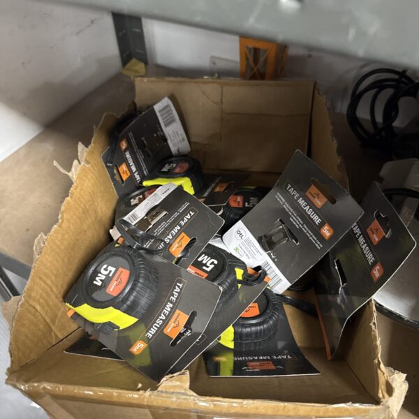 Tray of new yellow and black 5 meter tape measures.