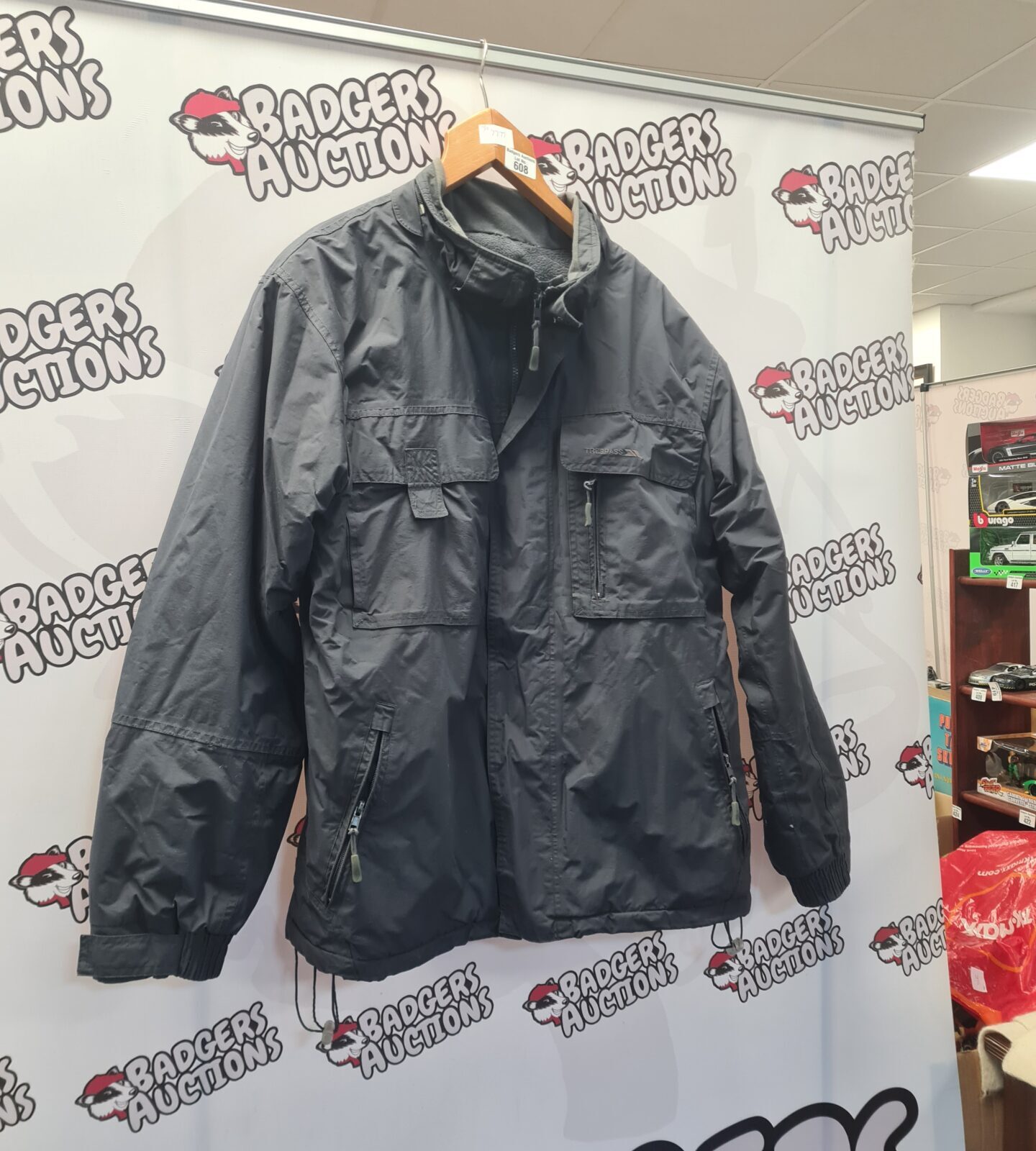 Men's size L Trespass Glacier waterproof jacket for outdoor activities.