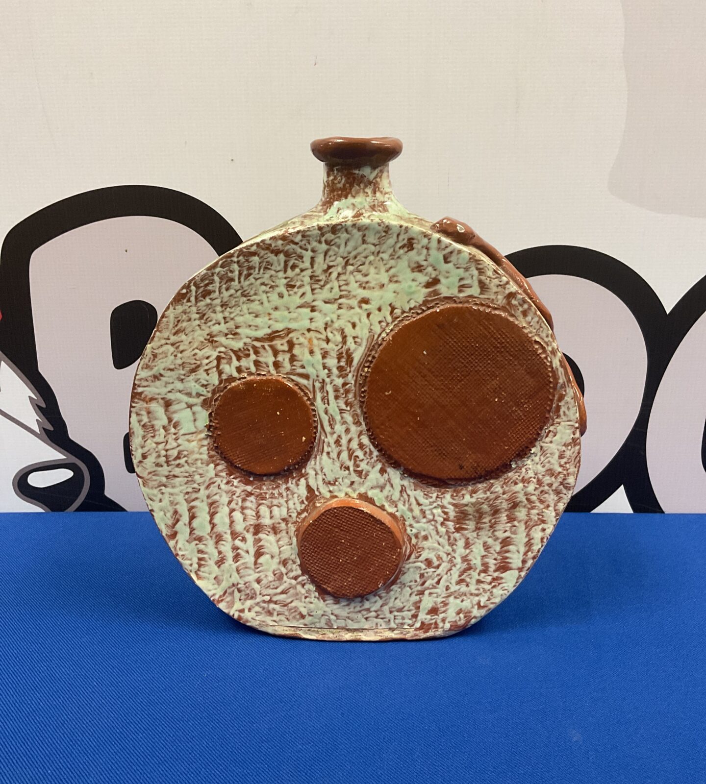 Textured Troika style pottery vase with a unique design.