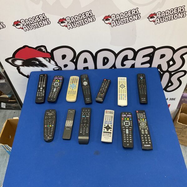 Mixed lot of TV remote controls from various brands.