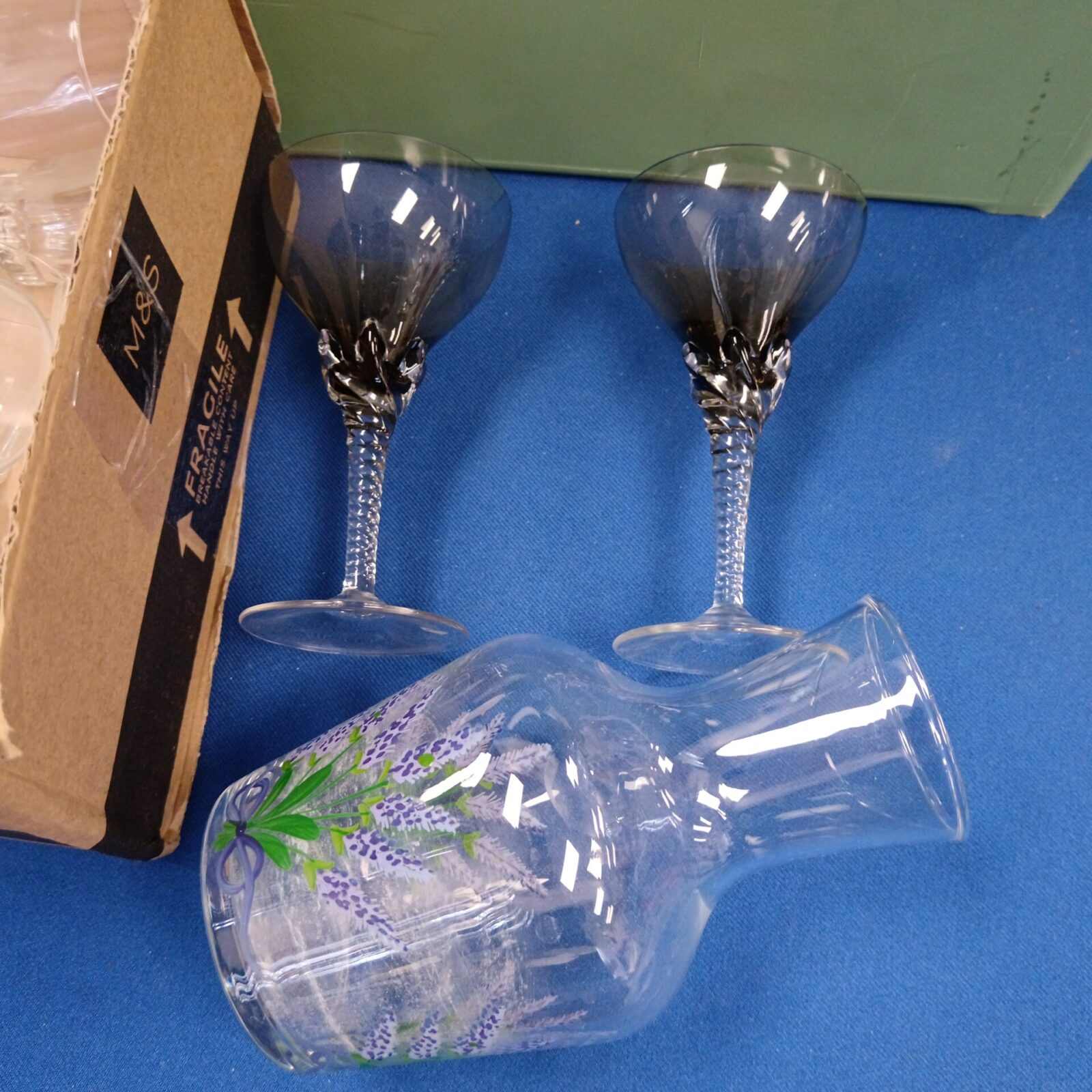 Close-up of vintage twist stem glasses with decorative details.