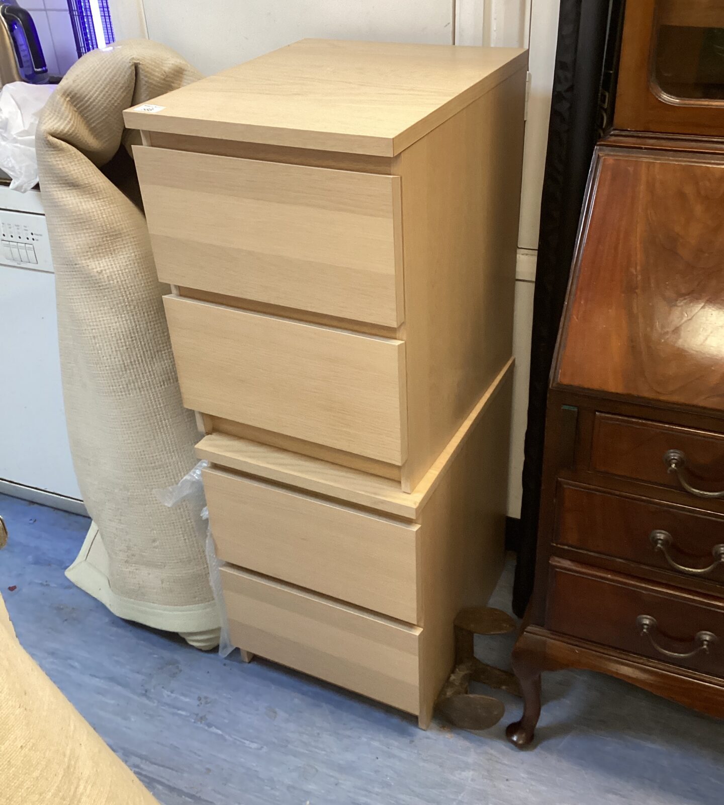 Pair of wooden under desk cabinets for office storage.