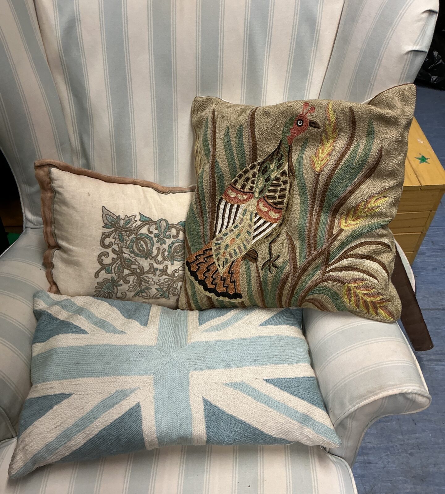 Union Jack patterned decorative cushion on a chair.