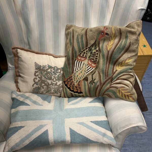 Union Jack patterned decorative cushion on a chair.