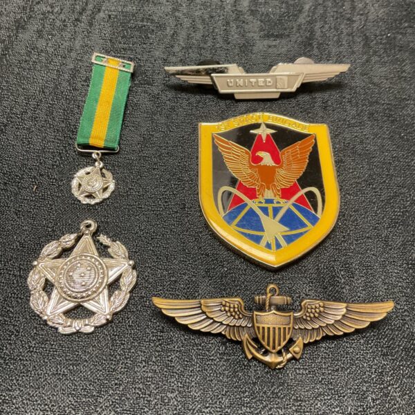 US Navy and United Airlines badges and medals collection for collectors.