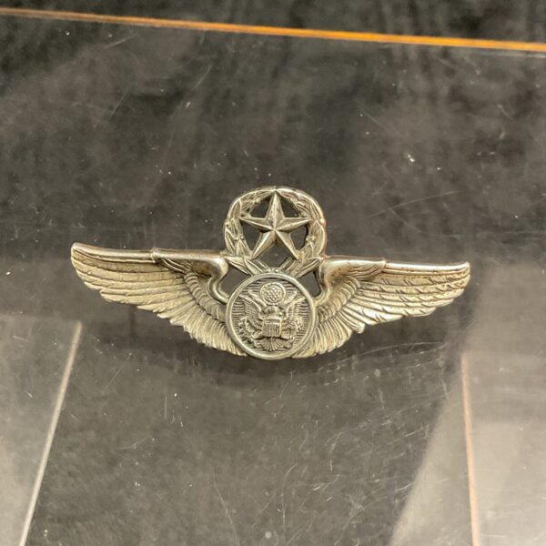 Detailed front view of a vintage USAF Master Aircrew Badge in sterling silver.