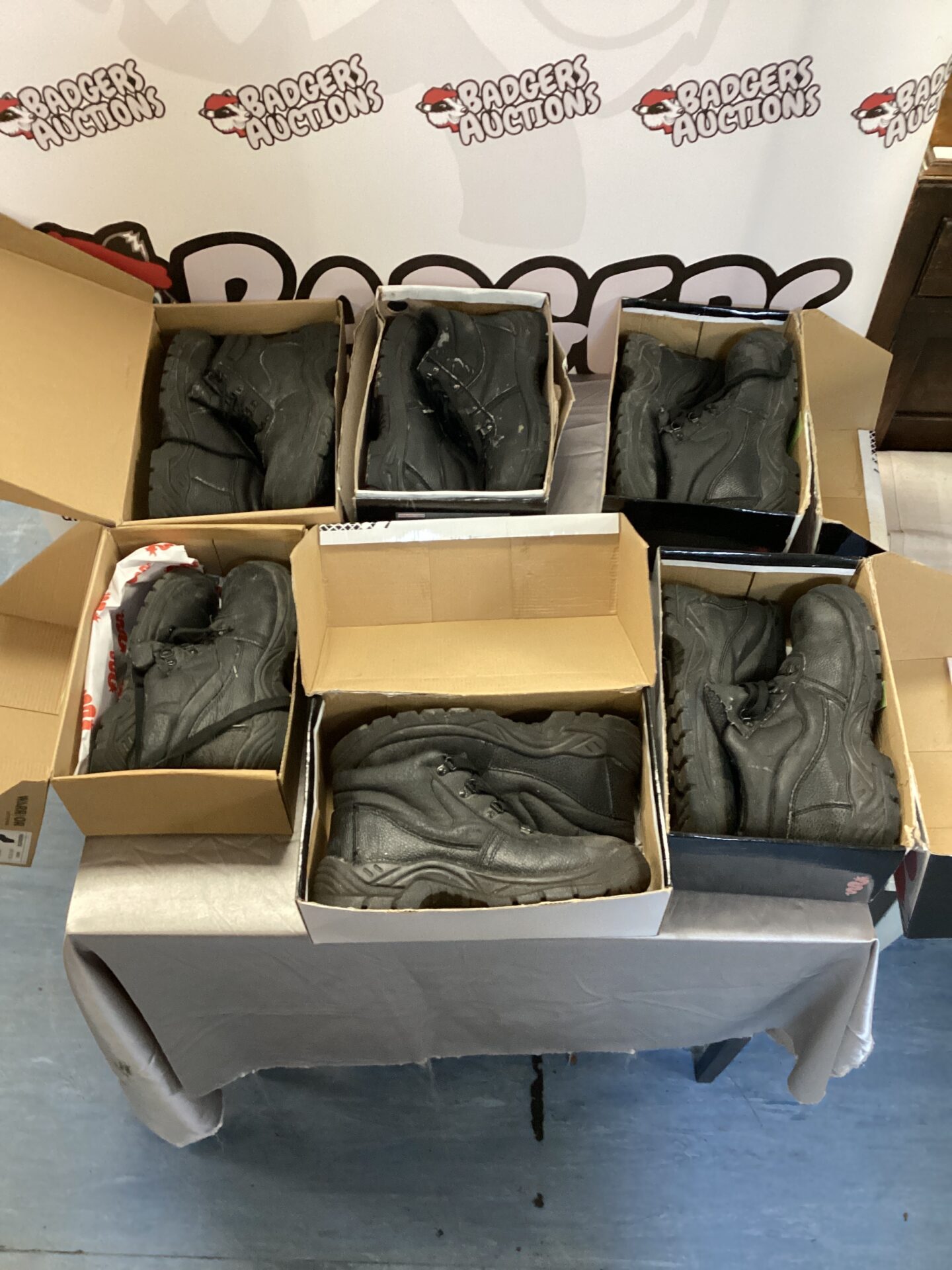 Lot of six pairs of used safety shoes for work.