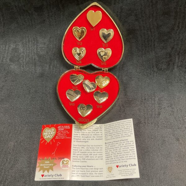 Front view of a vintage Variety Club Gold Heart pin.
