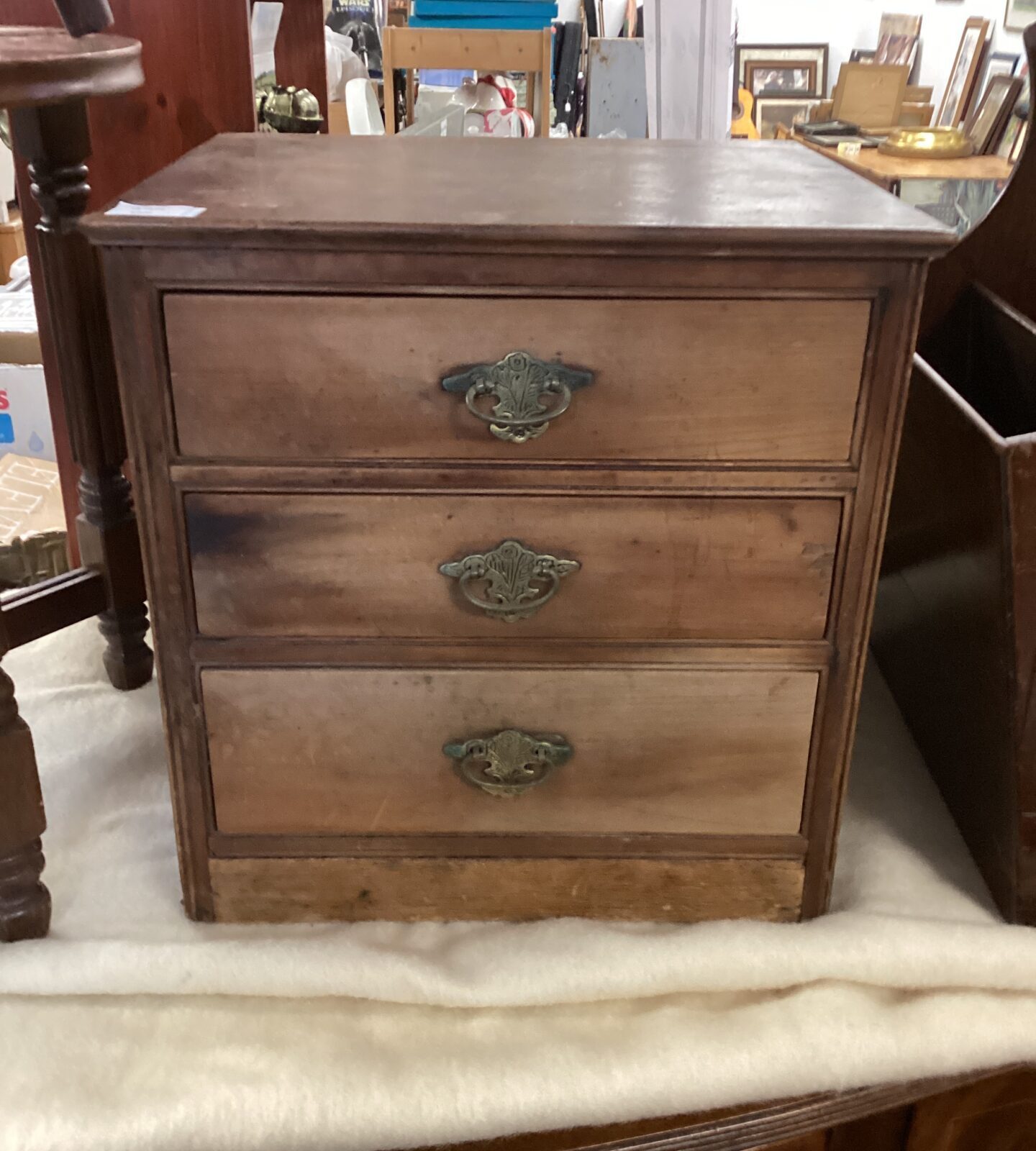 Antique Victorian desktop cabinet with three drawers.