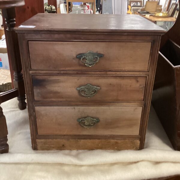 Antique Victorian desktop cabinet with three drawers.