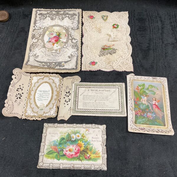Antique Victorian ephemera cards for Christmas, New Year, and Valentine's Day.