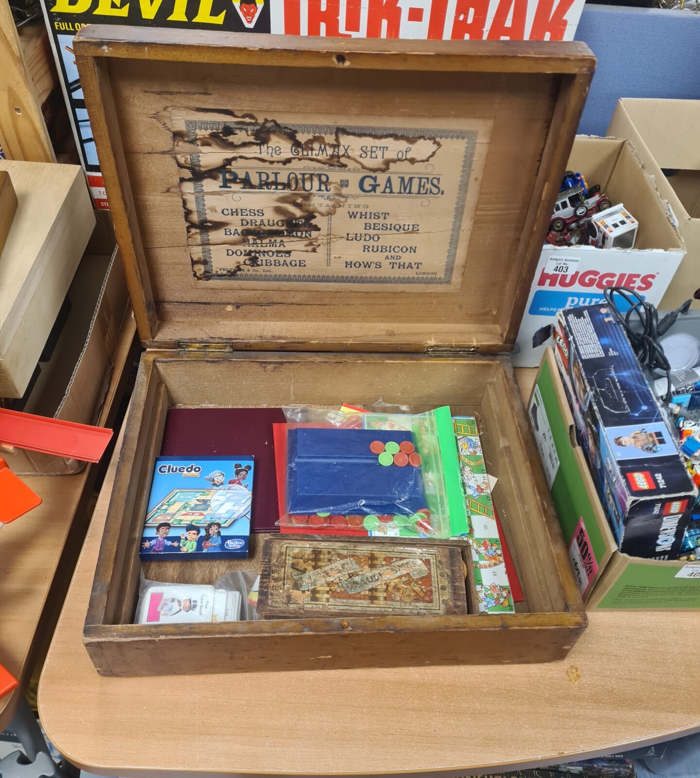 Close-up of the lid of a Victorian parlour games box with "The Climax Set" printed on it.