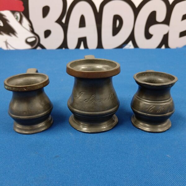 Lot of three antique Victorian pewter measures for pub use.
