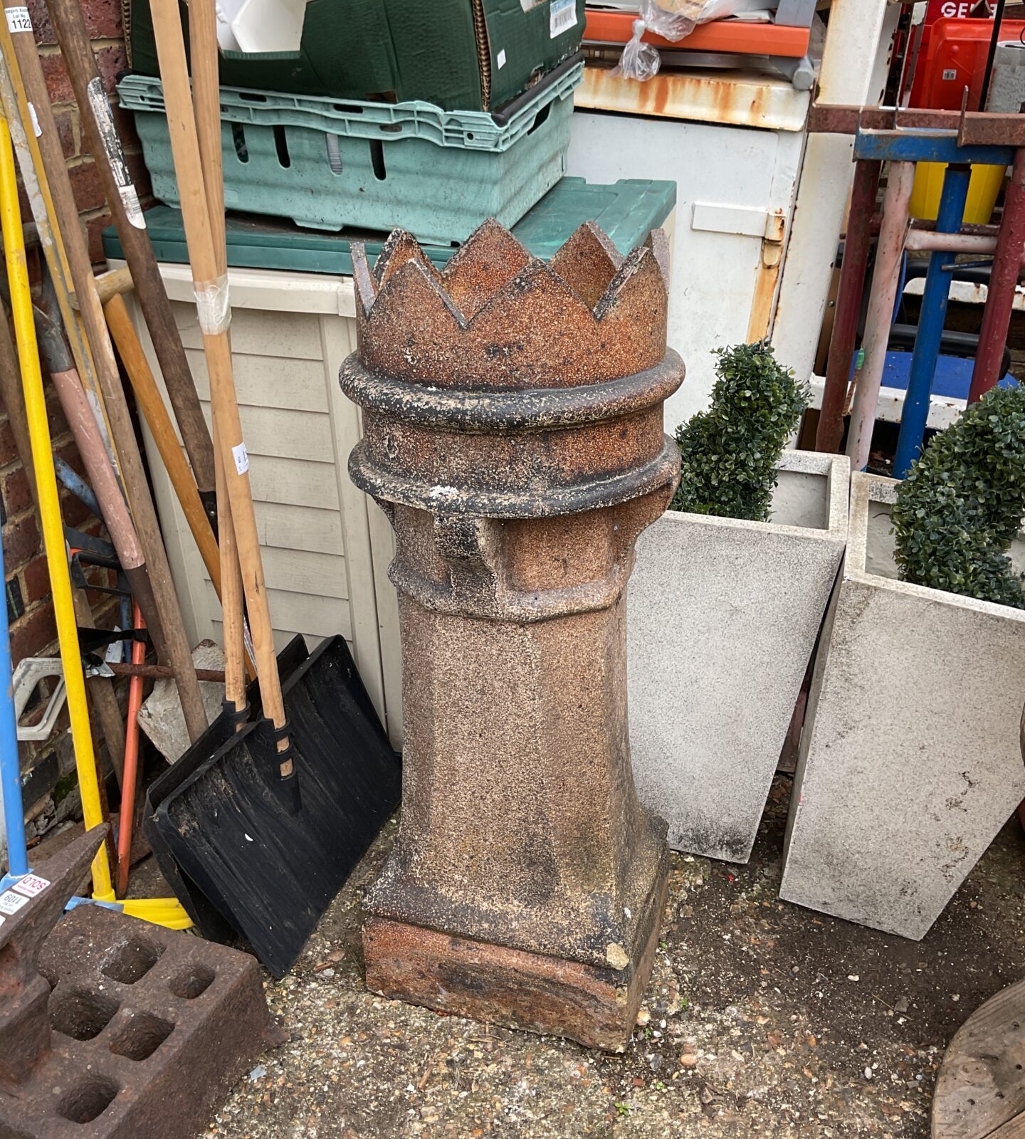 Large Victorian terracotta chimney pot with crown detail.