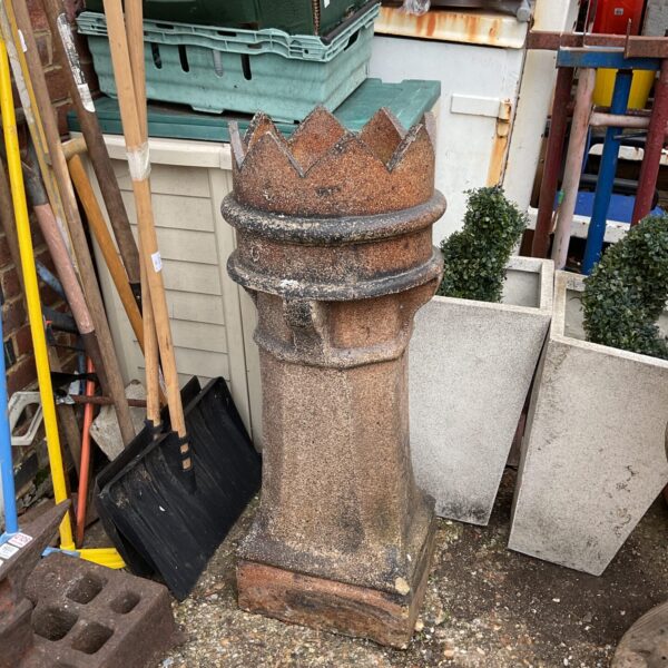 Large Victorian terracotta chimney pot with crown detail.