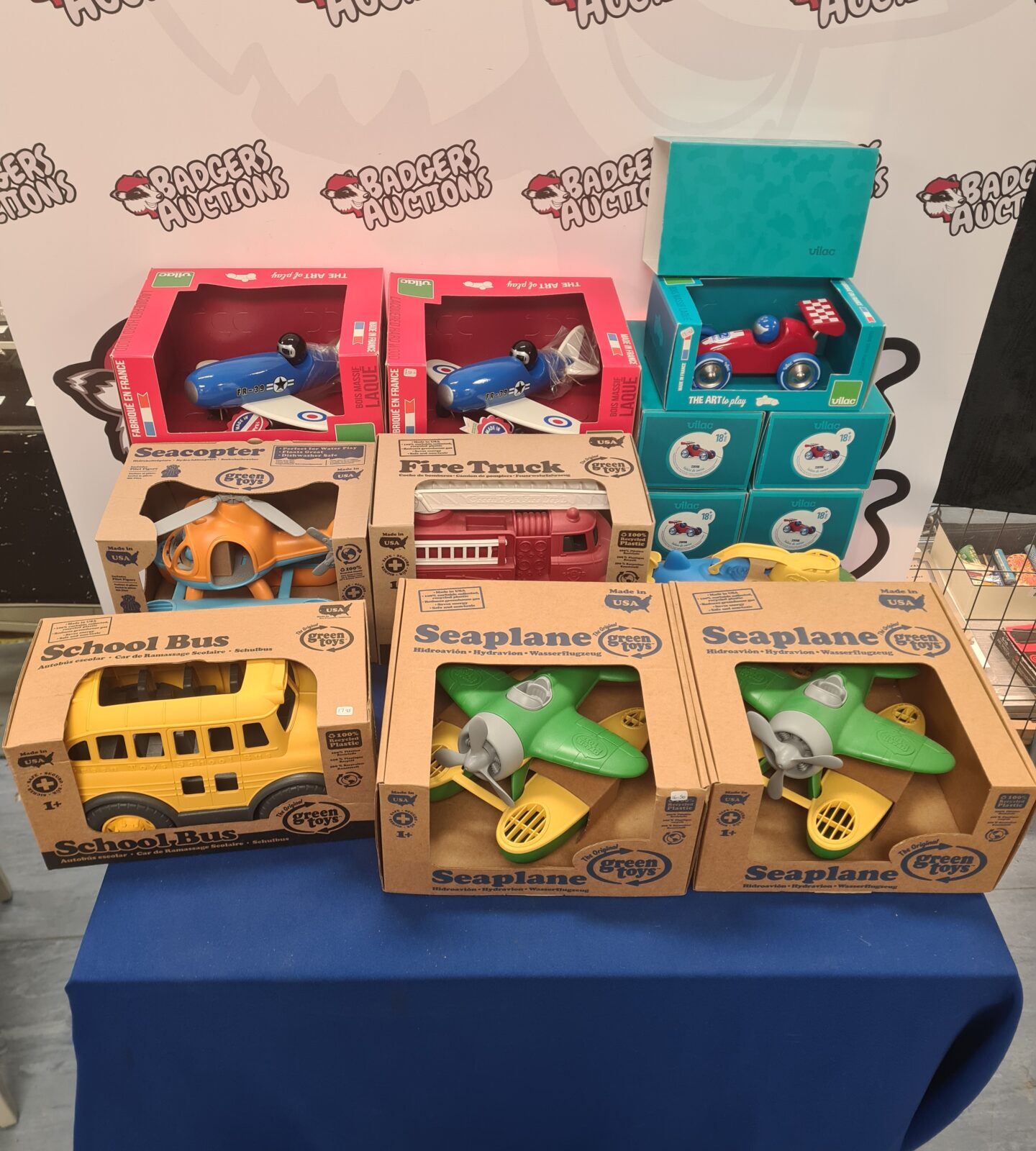 Vilac and Green Toys vehicle bundle with colourful wooden and plastic toys.