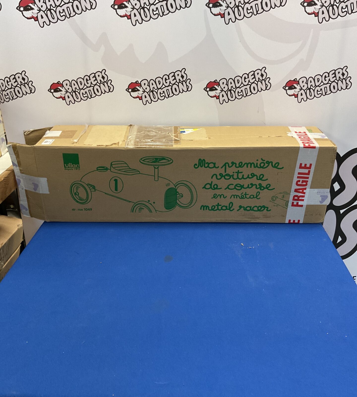New boxed Vilac metal ride-on racer for children.