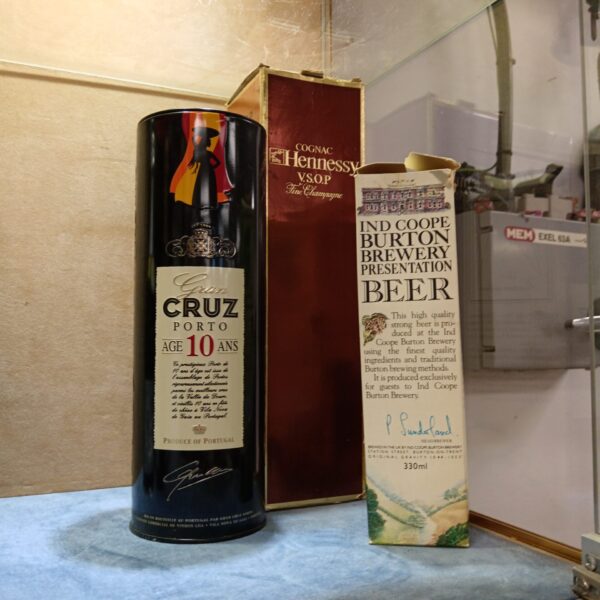 Vintage alcohol lot featuring Hennessy, Gran Cruz, and Burton Brewery bottles.