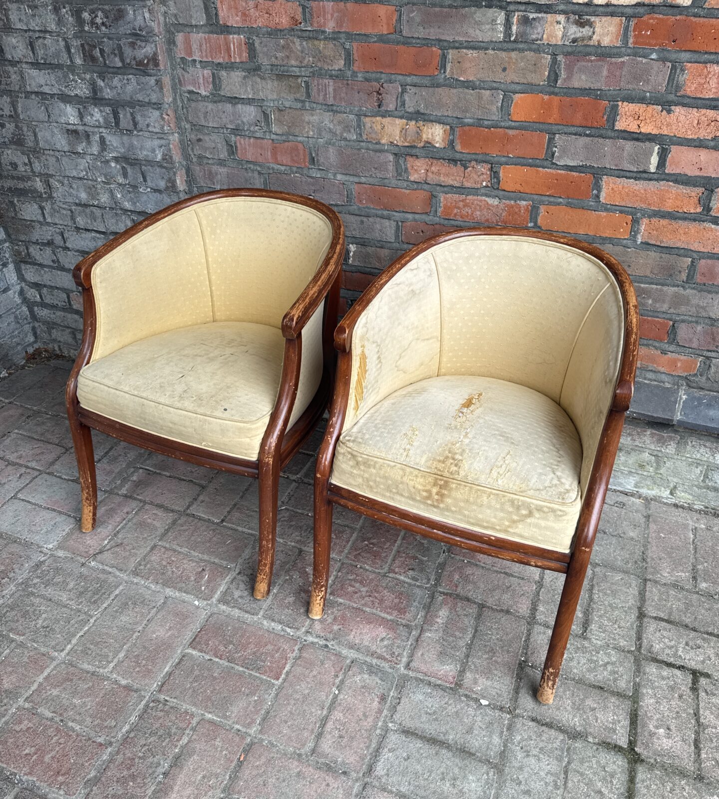 Pair of vintage Art Deco club chairs needing restoration.